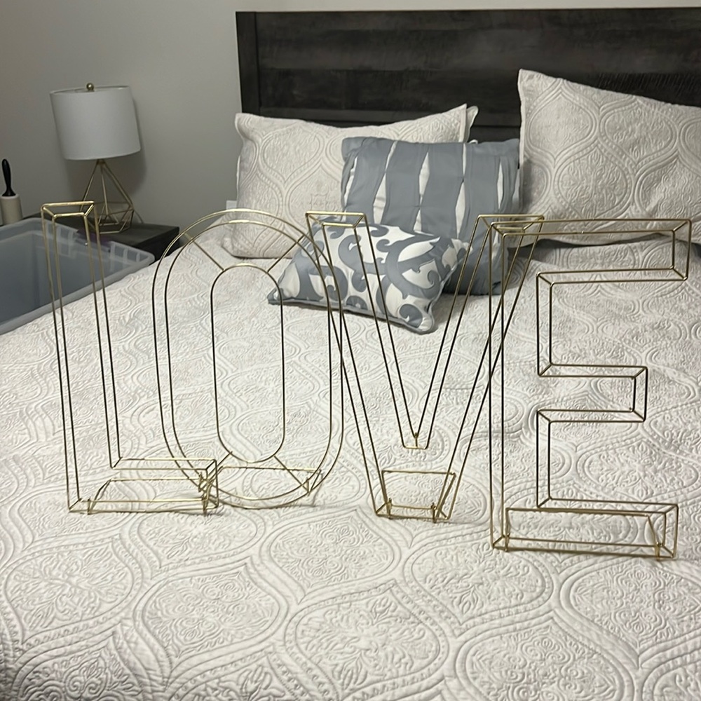 Gold, decorative LOVE letters- perfect for weddings. Fold down for easy storage!